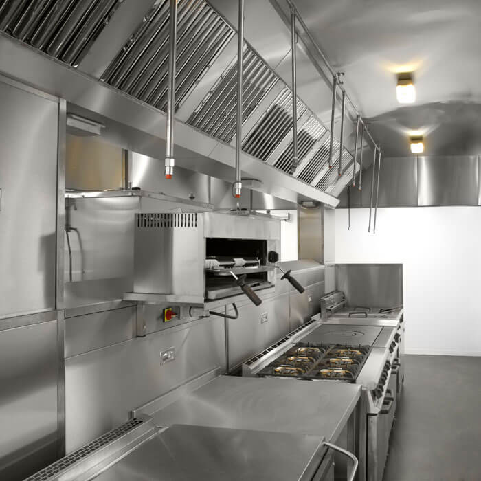 Commercial kitchen with stainless steel appliances and a ceiling sprinkler system in Phoenix, AZ