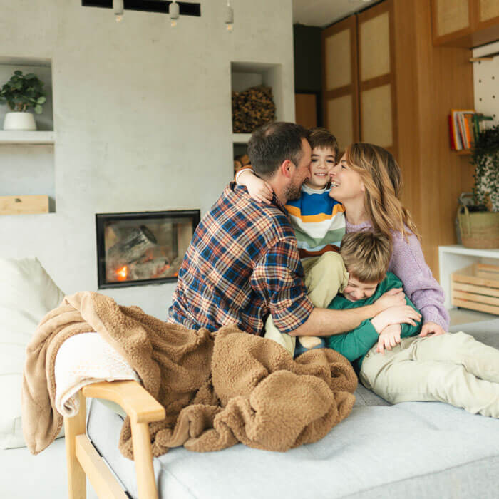 Family enjoying a safe living room with fire safety installation in Phoenix, AZ